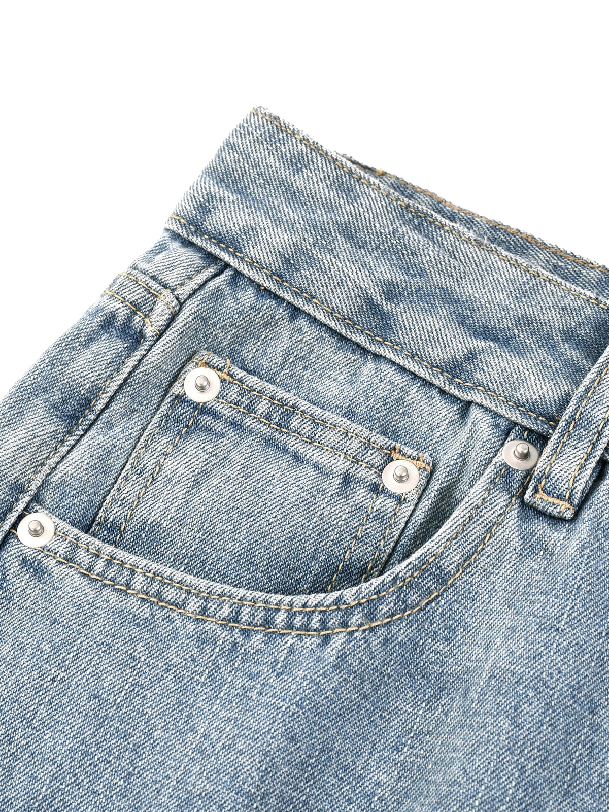 Blue vintage-wash denim jeans, up close