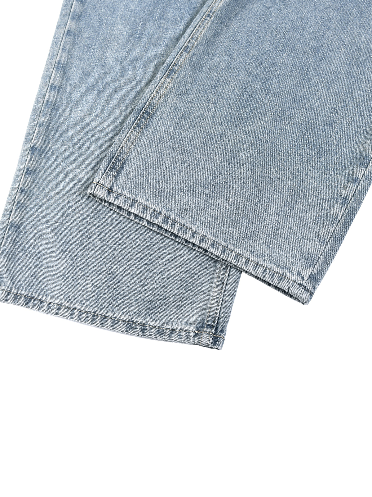 Blue vintage-wash denim jeans, up close