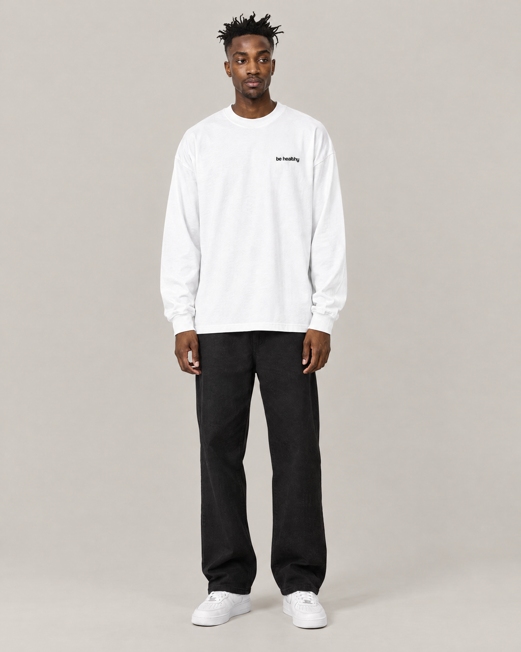 Red Light, Healthy Life oversized long sleeve tee in white, front. C is 6'2" and wears size M
